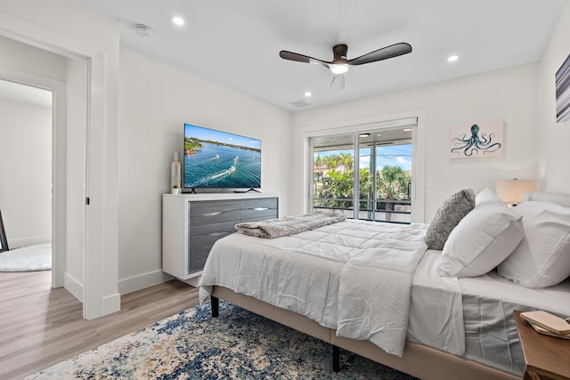 bedroom featuring ceiling fan, access to exterior, and light hardwood / wood-style flooring