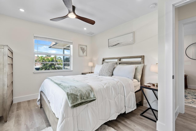 bedroom featuring ceiling fan and light hardwood / wood-style floors