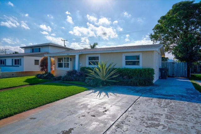 ranch-style home with a front yard