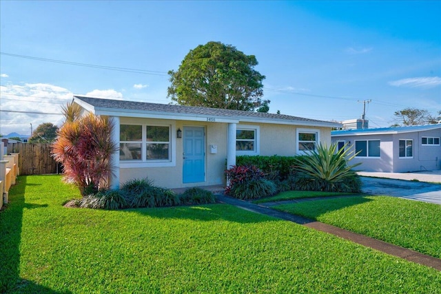 ranch-style house with a front lawn