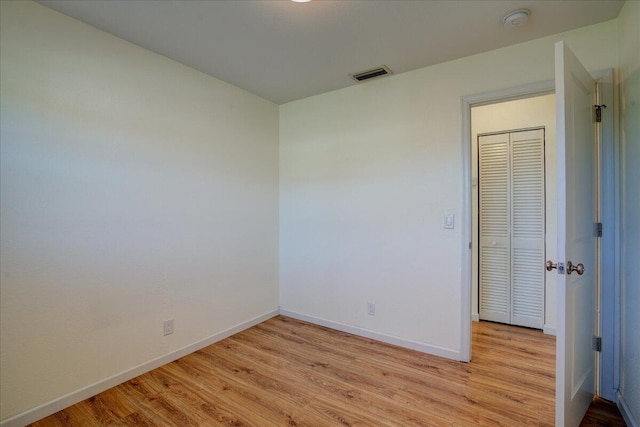 unfurnished room featuring light wood-type flooring