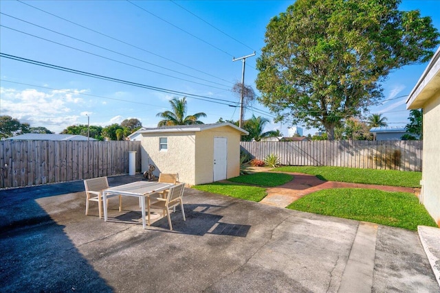 view of patio featuring a shed