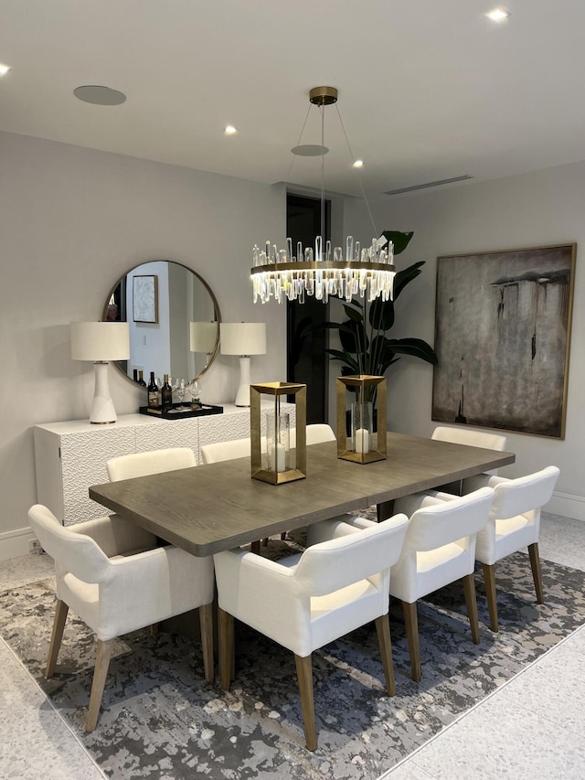 dining area with baseboards and recessed lighting