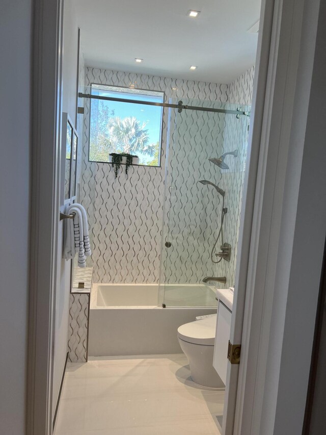 full bath with toilet, vanity, and shower / bathtub combination