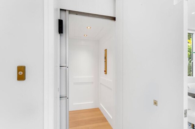 260 31st St, West Palm Beach, FL 33407 - hallway with light wood-type flooring and recessed lighting