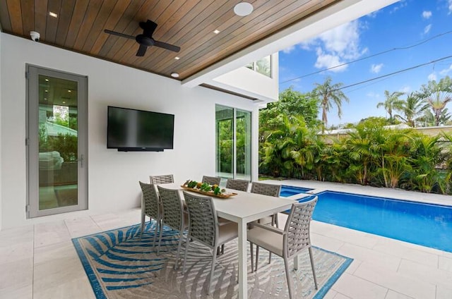 260 31st St, West Palm Beach, FL 33407 - view of pool with a patio area, a ceiling fan, a pool with connected hot tub, and outdoor dining space