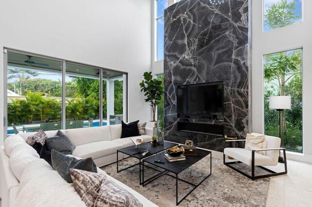 260 31st St, West Palm Beach, FL 33407 - living area with a high ceiling and healthy amount of natural light