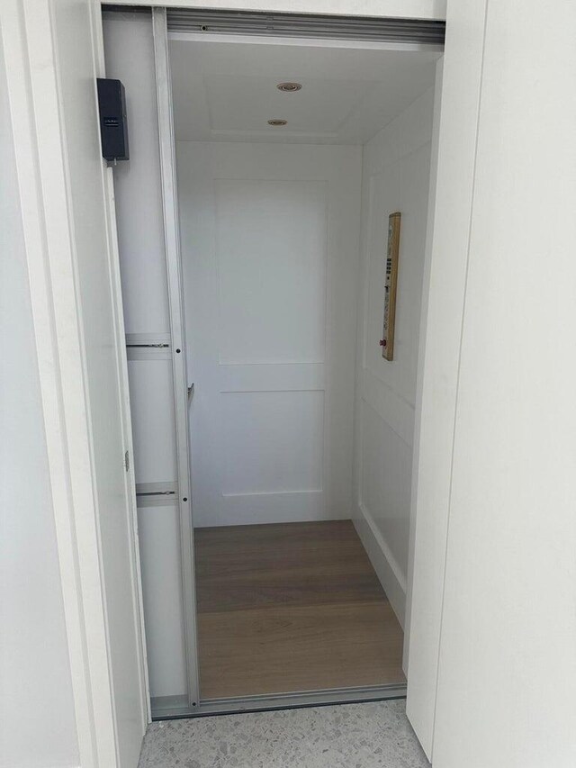 bathroom with vanity and a shower with shower door