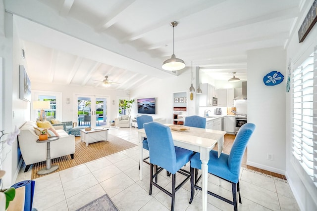 dining room featuring sink, french doors, vaulted ceiling with beams, and light tile patterned floors