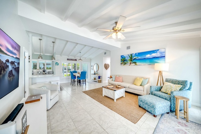 living room featuring ceiling fan, vaulted ceiling with beams, and light tile patterned floors