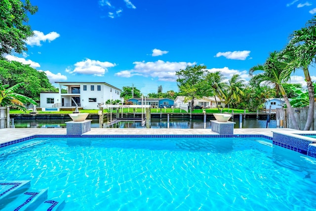 view of swimming pool featuring a dock and a water view