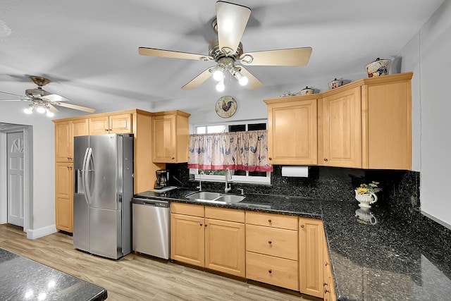 602 SE 6th Ave, Deerfield Beach, FL 33441 - kitchen with appliances with stainless steel finishes, light brown cabinetry, sink, dark stone countertops, and light hardwood / wood-style floors