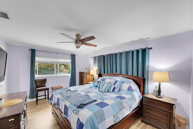 602 SE 6th Ave, Deerfield Beach, FL 33441 - bedroom with ceiling fan, ornamental molding, and light hardwood / wood-style floors