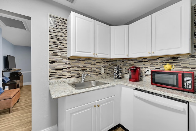 602 SE 6th Ave, Deerfield Beach, FL 33441 - kitchen with sink, backsplash, white cabinets, and white dishwasher