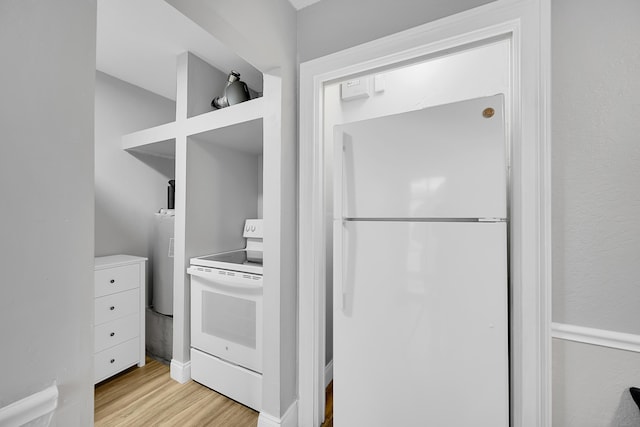 602 SE 6th Ave, Deerfield Beach, FL 33441 - kitchen featuring white appliances and light hardwood / wood-style flooring