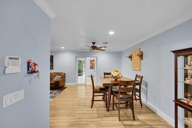 602 SE 6th Ave, Deerfield Beach, FL 33441 - dining space featuring crown molding, ceiling fan, and light wood-type flooring