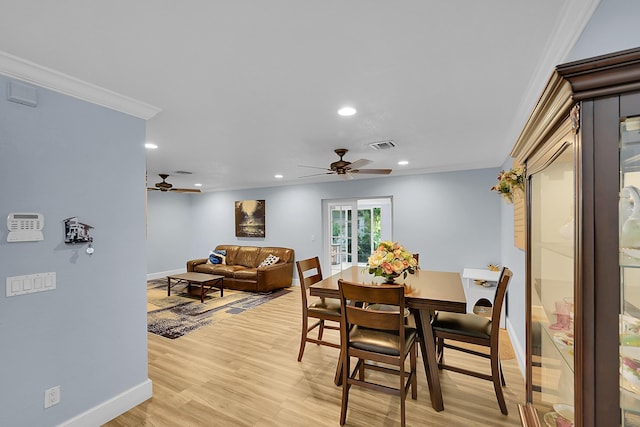 602 SE 6th Ave, Deerfield Beach, FL 33441 - dining area with ornamental molding, ceiling fan, and light wood-type flooring