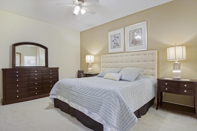 bedroom with ceiling fan and light colored carpet