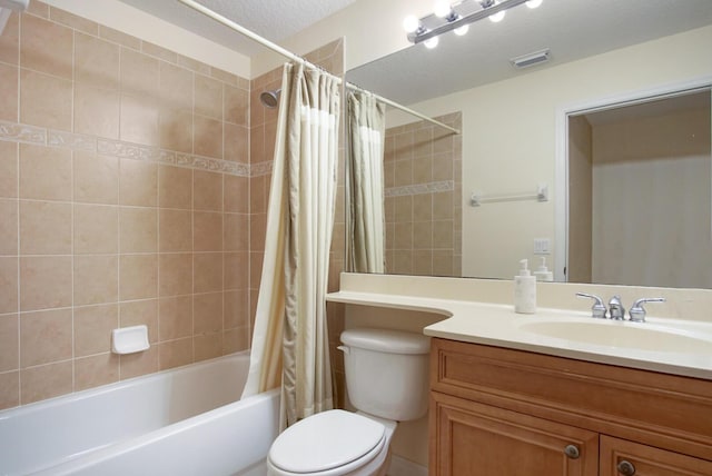 full bathroom with a textured ceiling, toilet, vanity, and shower / tub combo with curtain