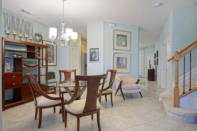 dining area with an inviting chandelier