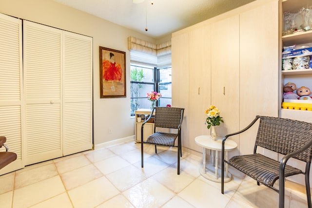 living area with tile patterned flooring