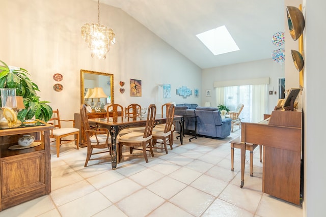 tiled dining room featuring a chandelier and lofted ceiling with skylight