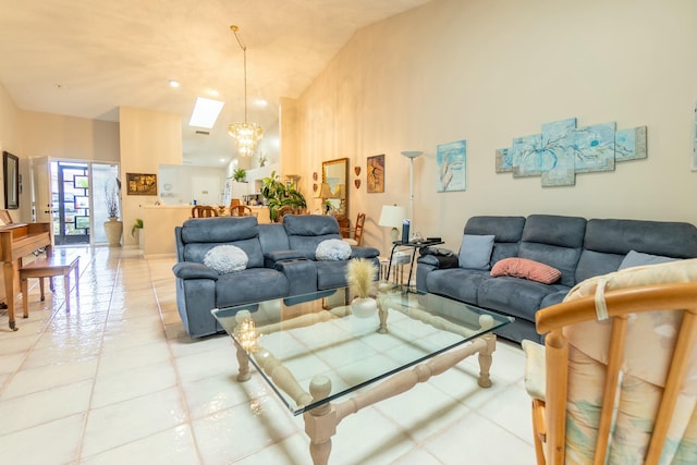 tiled living room featuring a high ceiling and a notable chandelier