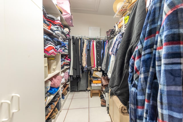 spacious closet featuring light tile patterned floors