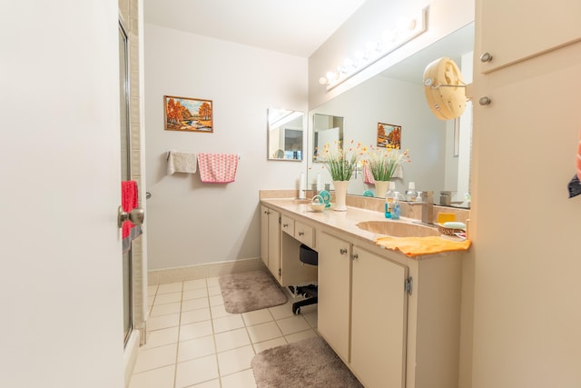 bathroom featuring tile patterned flooring, walk in shower, and vanity