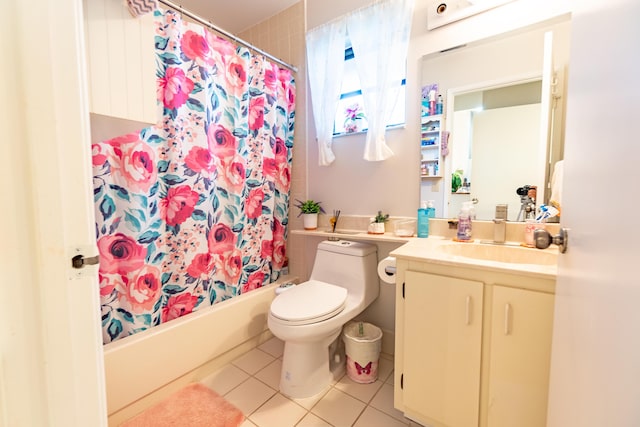 full bathroom with shower / bath combo with shower curtain, toilet, tile patterned floors, and vanity