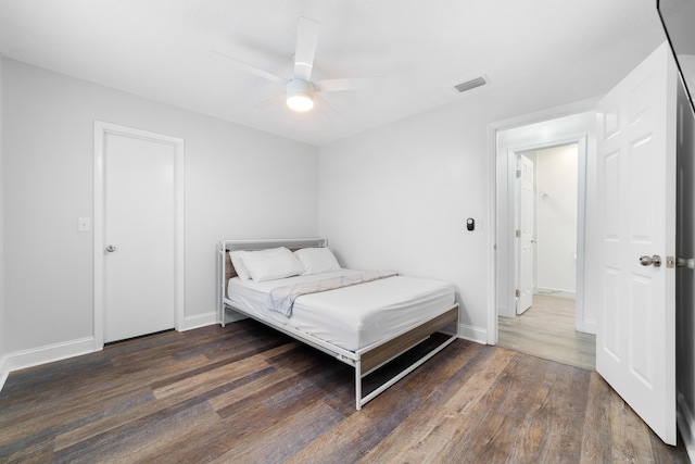 bedroom with dark wood-type flooring and ceiling fan