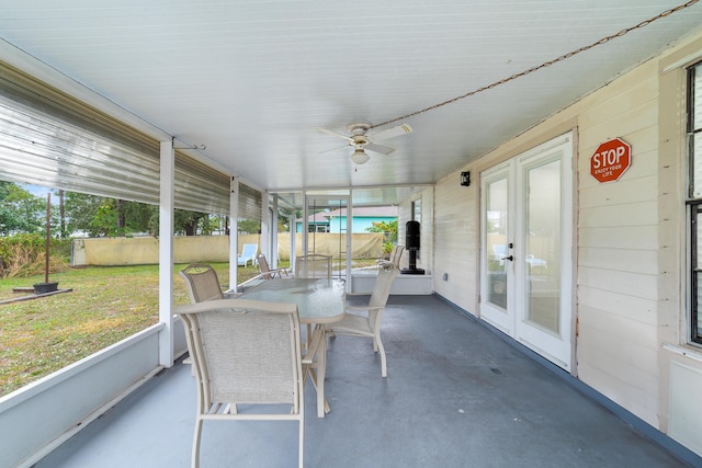 unfurnished sunroom with french doors and ceiling fan