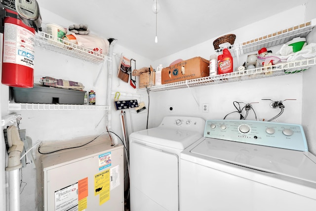 clothes washing area featuring independent washer and dryer