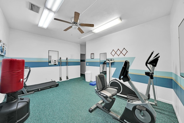 workout room featuring ceiling fan and carpet flooring