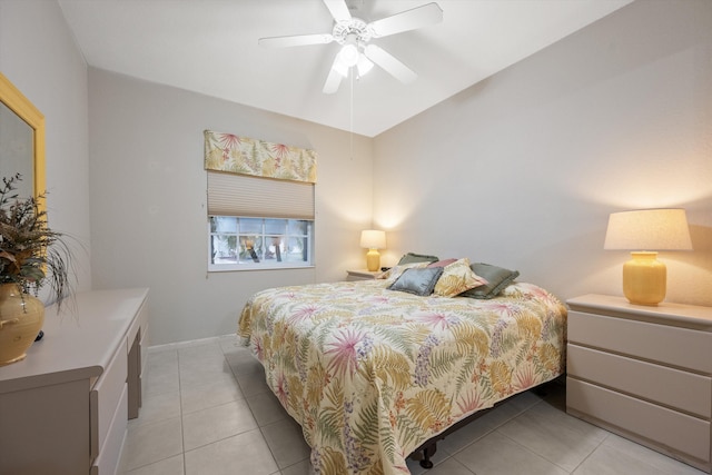 tiled bedroom with ceiling fan