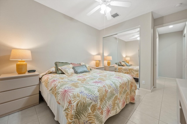 tiled bedroom with a closet and ceiling fan