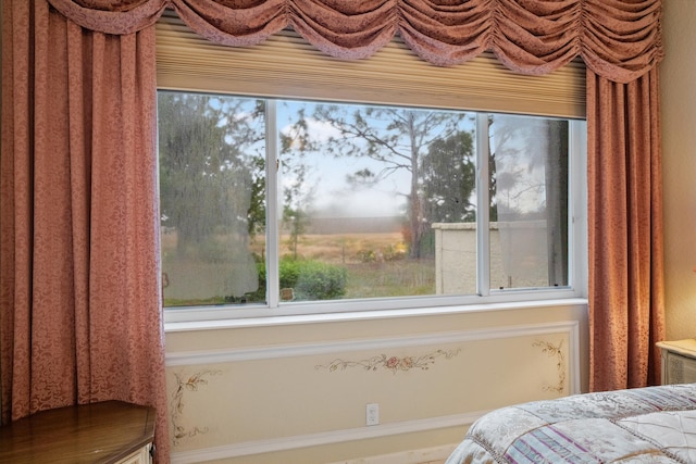 bedroom with multiple windows