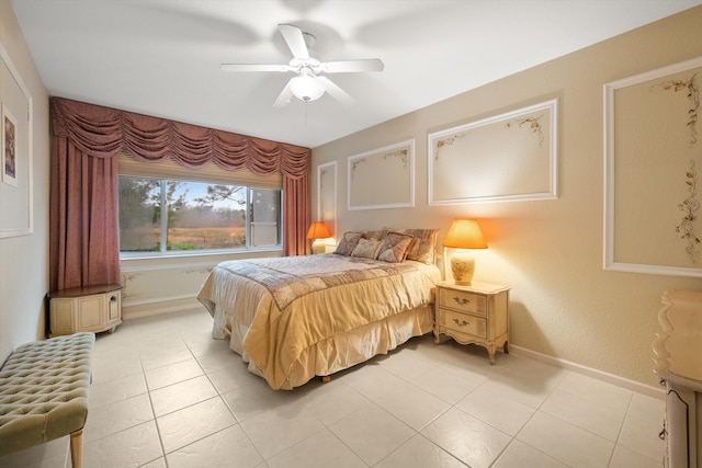 bedroom with ceiling fan and light tile patterned floors