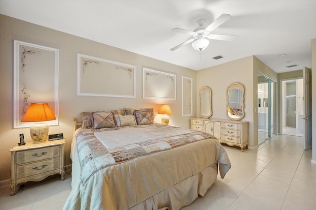 bedroom with ceiling fan, connected bathroom, and light tile patterned floors