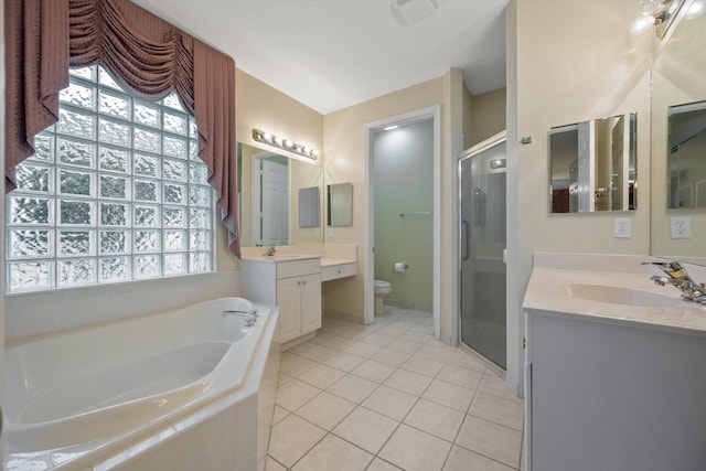 full bathroom featuring toilet, vanity, plus walk in shower, and tile patterned flooring