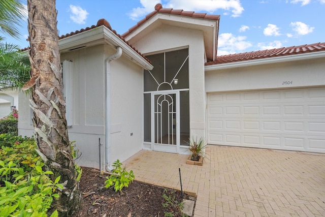 entrance to property featuring a garage