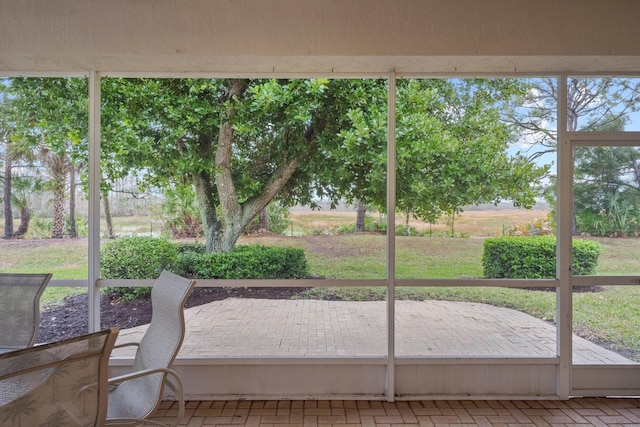 unfurnished sunroom with plenty of natural light