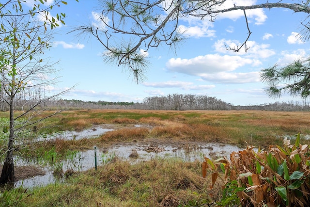 exterior space with a water view and a rural view