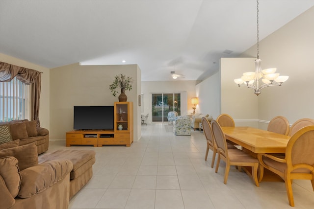 tiled dining room with vaulted ceiling and a chandelier