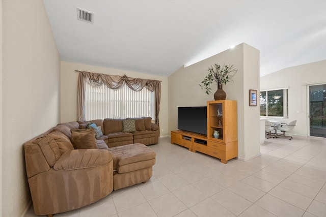 tiled living room featuring lofted ceiling