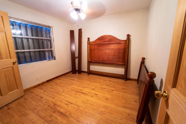 unfurnished bedroom featuring ceiling fan and light hardwood / wood-style flooring