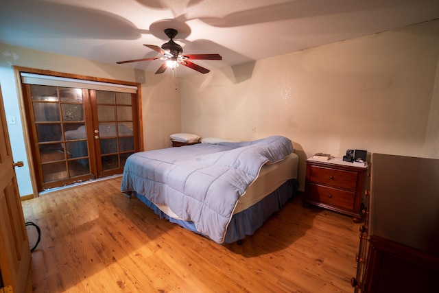 bedroom featuring ceiling fan and light hardwood / wood-style floors