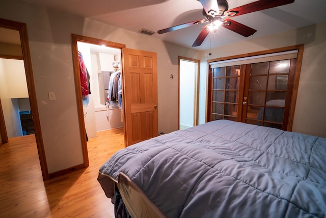 bedroom featuring a closet, ceiling fan, and light hardwood / wood-style floors