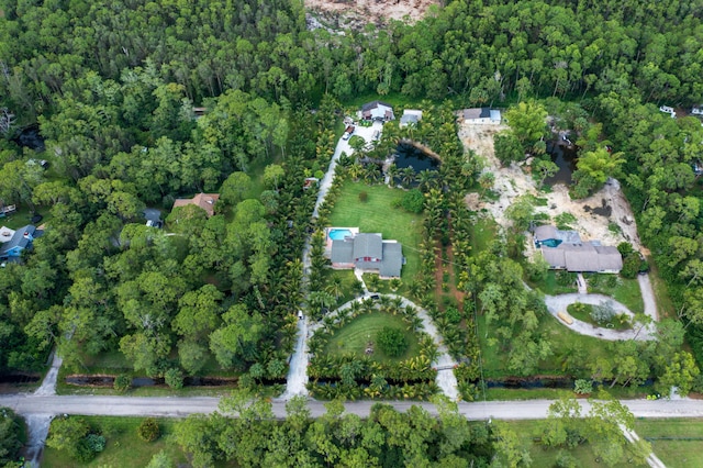 aerial view featuring a wooded view