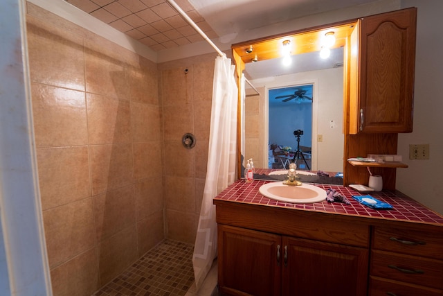 full bathroom featuring a stall shower and vanity